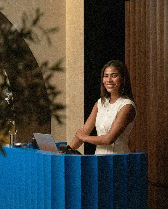 Hotel receptionist at the front desk