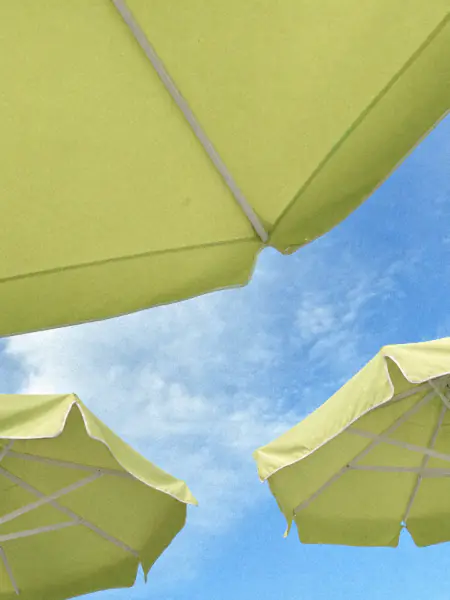 Lime umbrellas against a blue sky