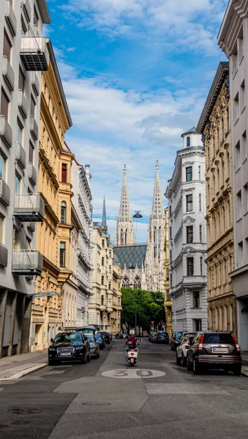 Vienna street looking towards the Votivkirche spires