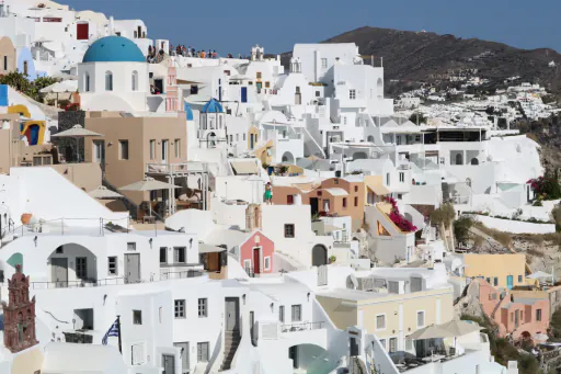 Whitewashed village houses above the sea in Greece