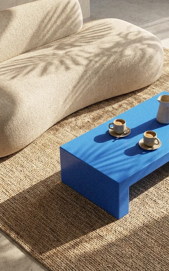 Lounge seating with a blue coffee table and two espresso cups