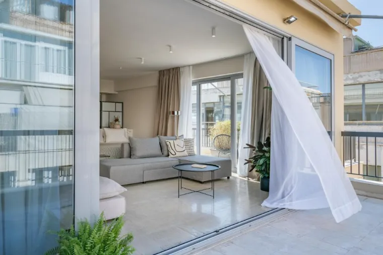 Apartment living room opening onto a balcony, Athens