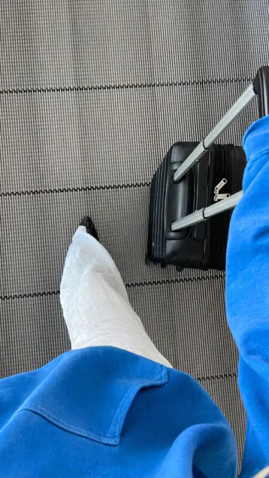 Guest walking through the terminal with a suitcase