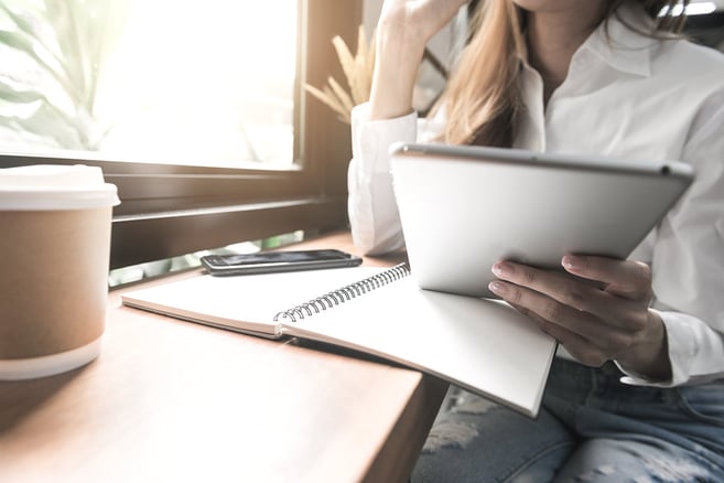 asian-casual-woman-freelancer-using-tablet-writing-plan-smile-with-coffee-cup-cafe-restaurant