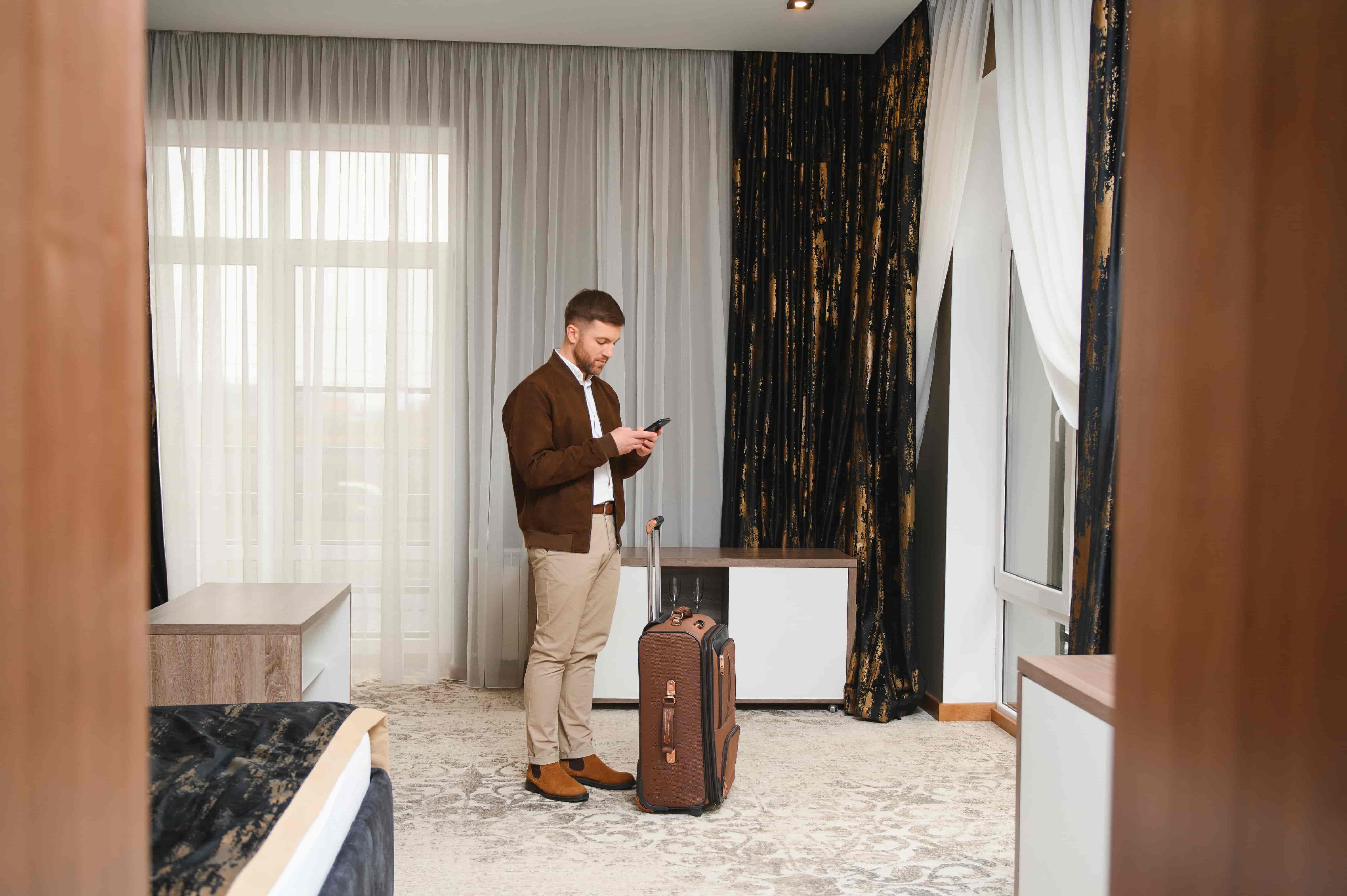 mature-businessman-in-a-hotel-room-2024-11-25-20-42-55-utc-min