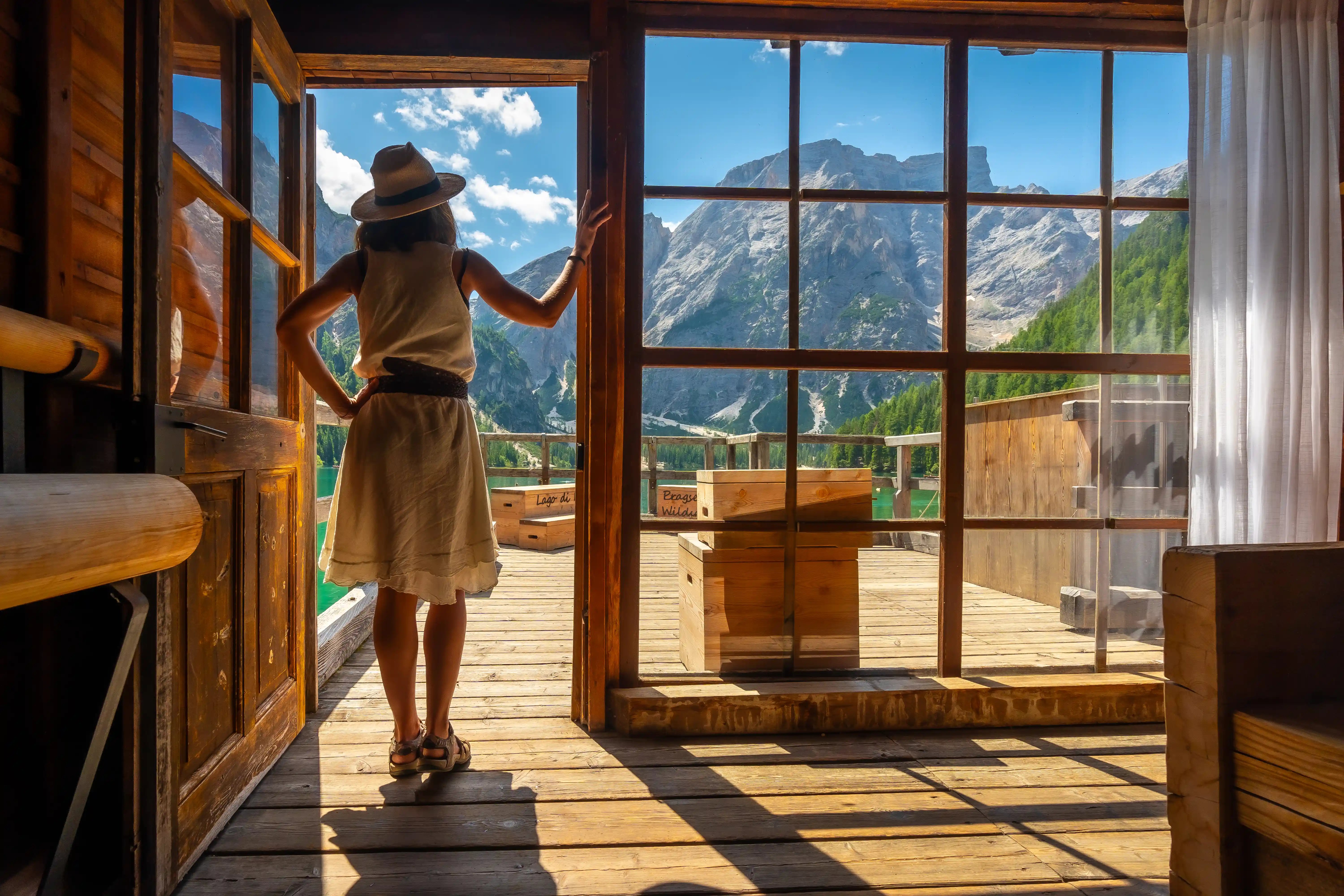 tourist-admiring-lake-braies-in-the-dolomites-from-2024-12-10-03-29-16-utc