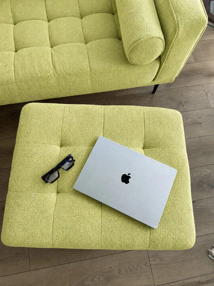 Laptop on a lime sofa