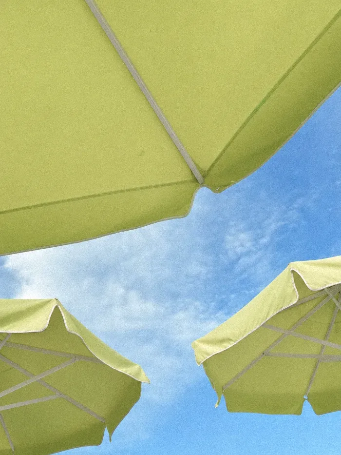 Lime parasols against a blue sky