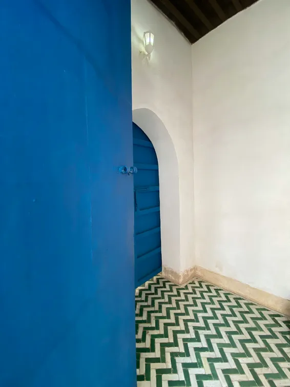 Blue hotel door in a whitewashed Turkish street